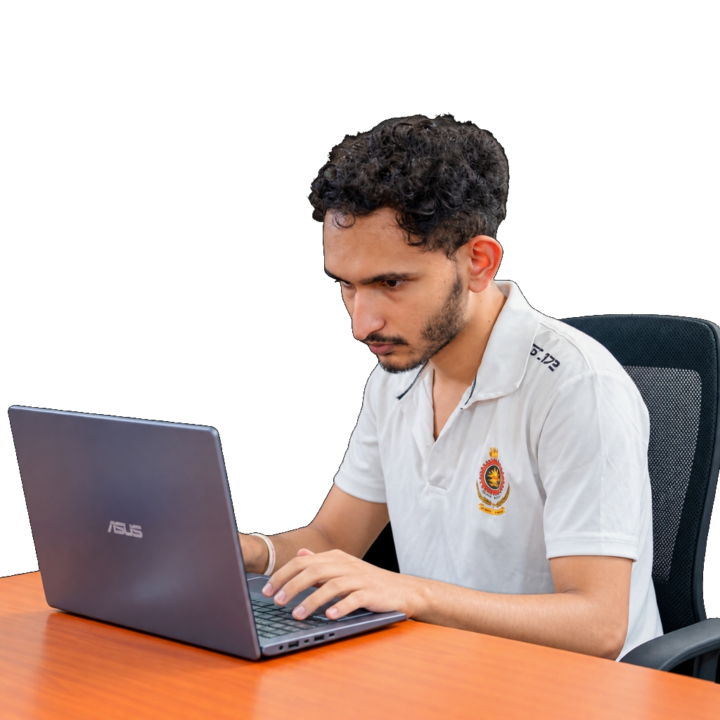 Dulan Prabashwara working on a laptop at a desk